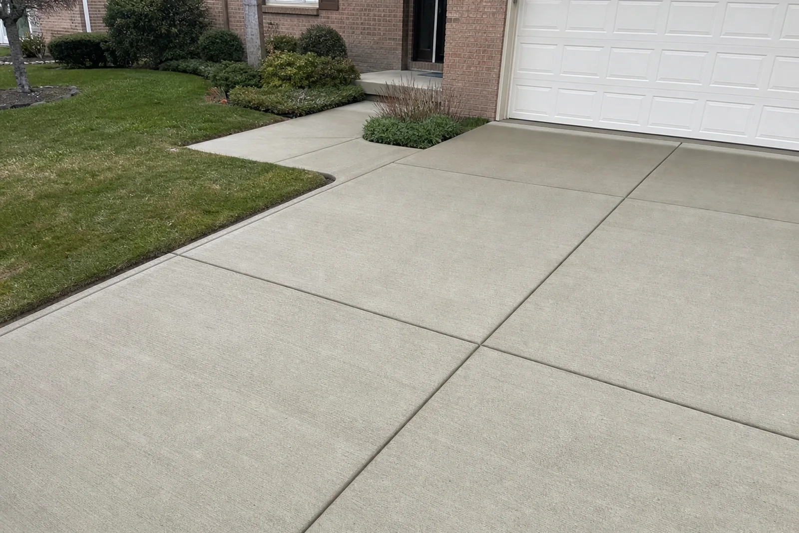 Finished broom concrete driveway and front walk at a St Joseph County Indiana home near Mishawaka and Granger